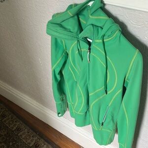 Lululemon bottom separating zipper.  Hooded lite weight jacket Thumb holes.